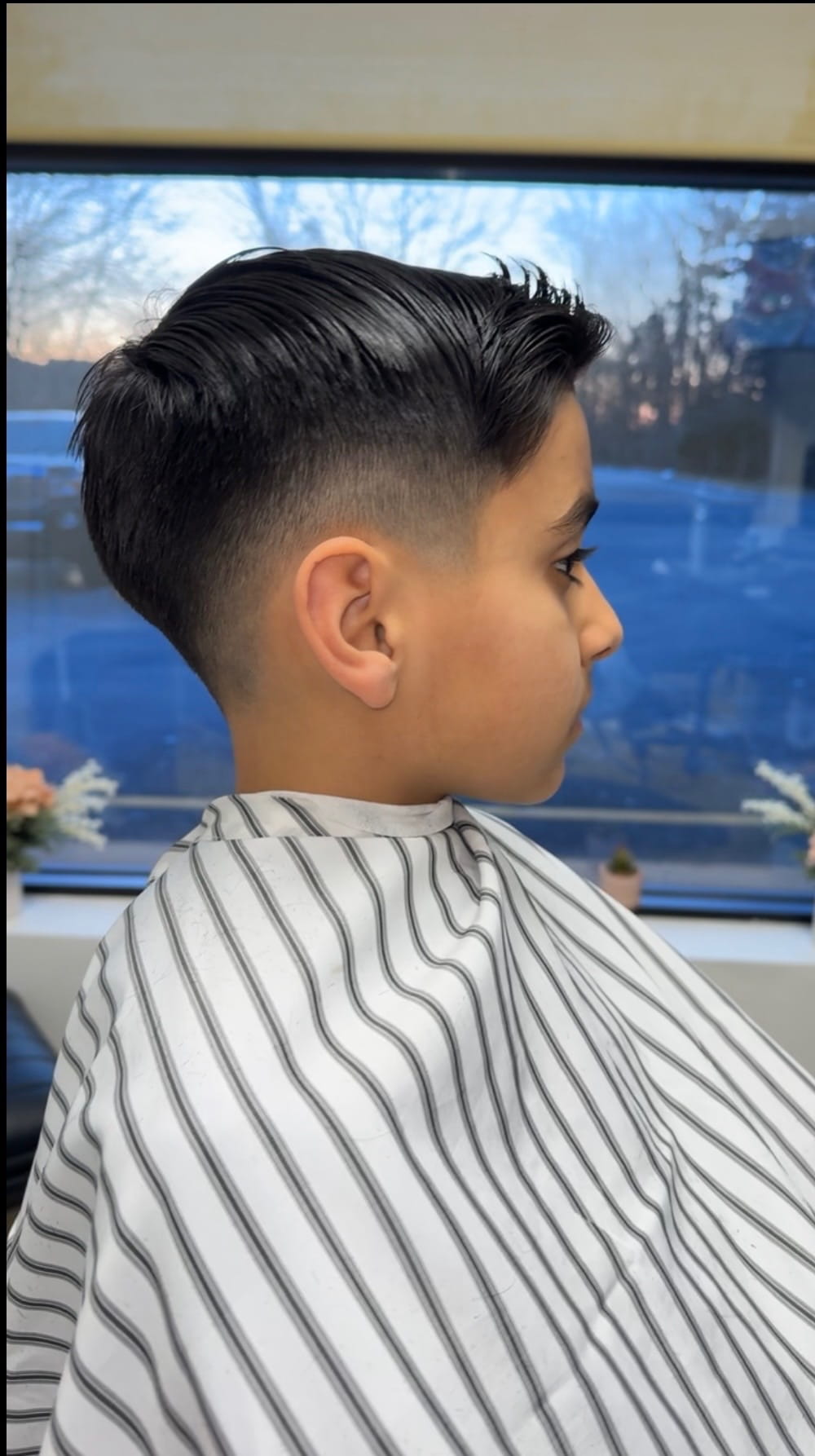 Kid haircut with smooth fade at 88 Mane Street salon
