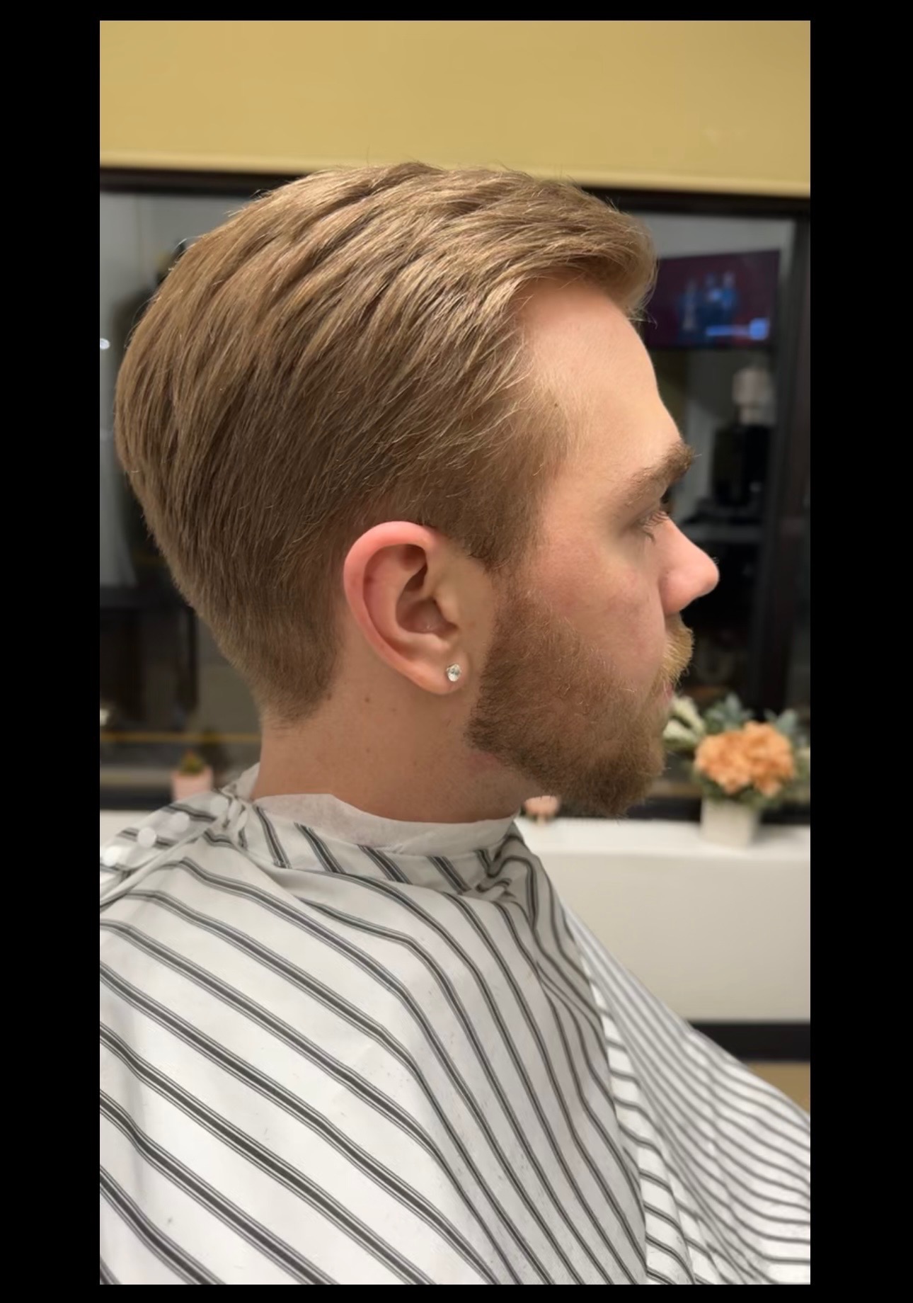 Short haircut profile with clean fade at 88 Mane Street