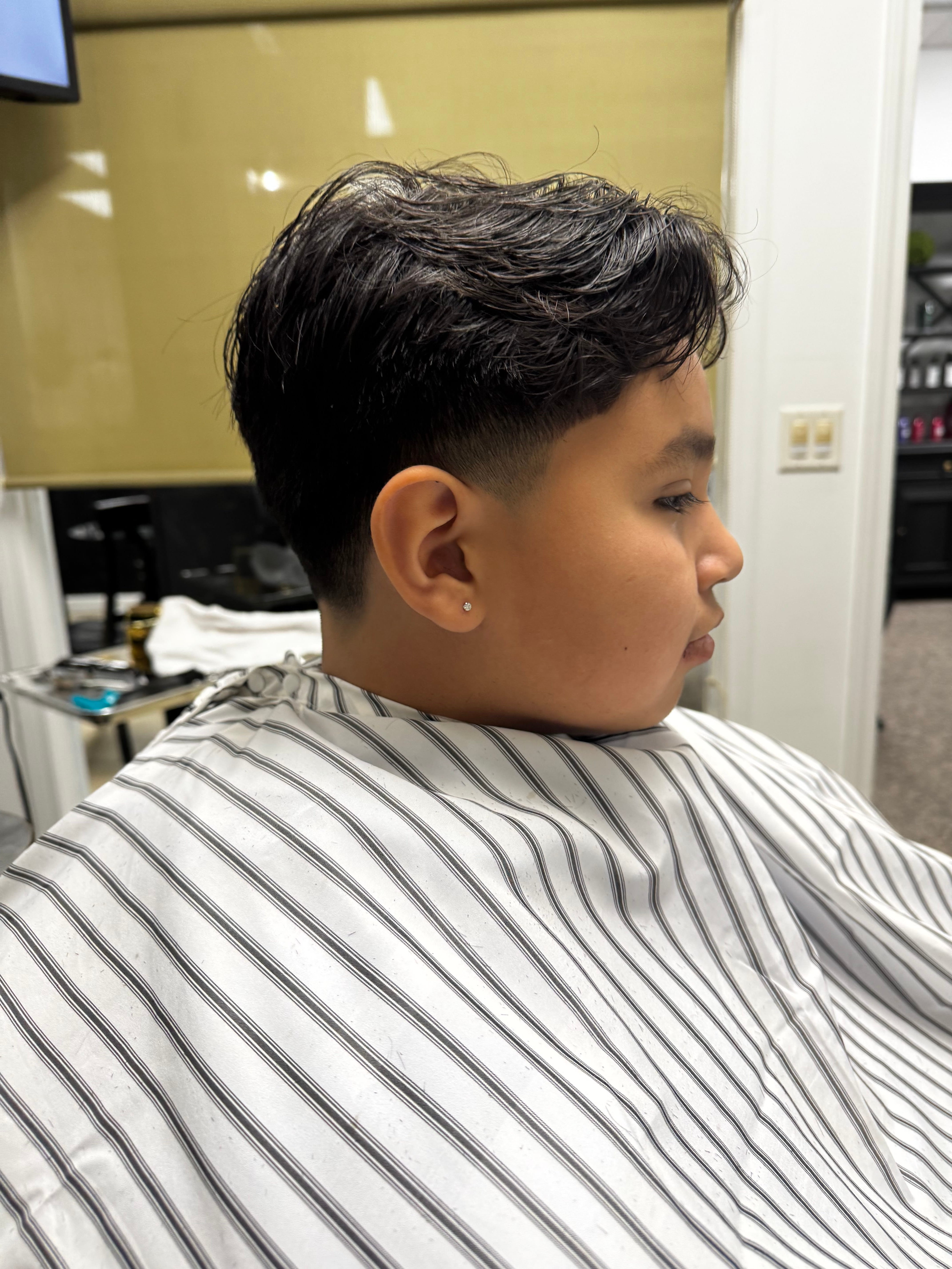 Short fade haircut profile at the salon